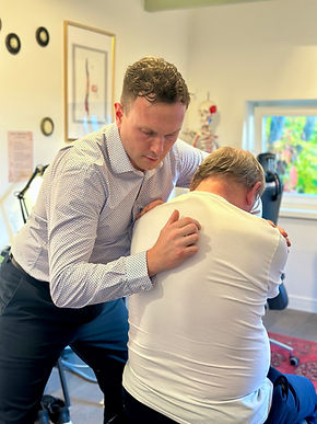 “Chiropractor Sopot performing Gonstead adjustment”