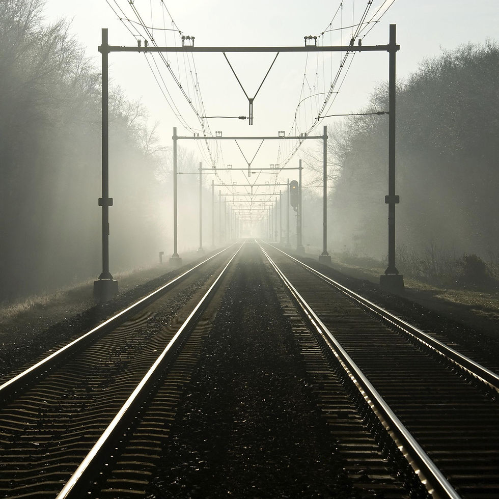 Railway tracks disappearing into the distance as visibility decreases further ahead, illustrating strategy execution and organisational adaptation under uncertainty.