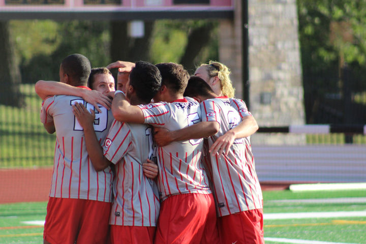 First Half Goals Lead to Red Men Triumph Over Titans