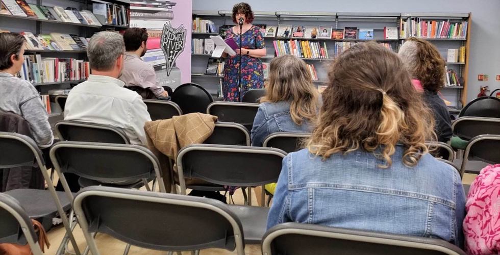 Sarah L Dixon, a female poet, presents a workshop and open mic