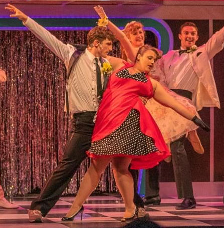 Cha-Cha and dancers in Grease
