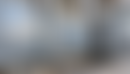 AI-generated close view of rectangular galvanized ductwork, supports and a flexible connector.