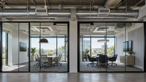 AI-generated view of adjacent office meeting rooms with exposed overhead HVAC ductwork.