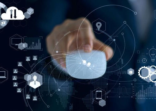 A hand touches a digital screen with data icons, graphs, and cloud symbols, on a dark, futuristic background.