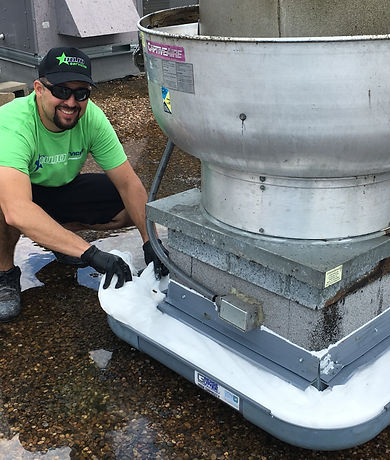 man_cleaning_the_kitchen_exhaust_system