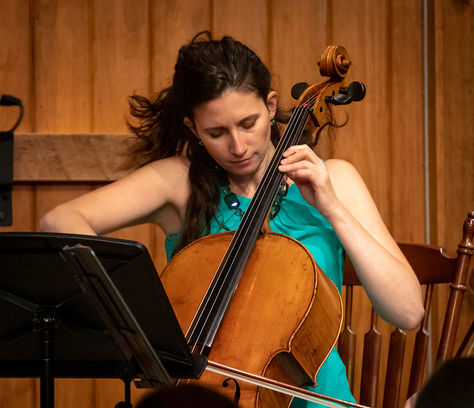 Cellist swaying in motion as she plays