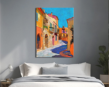 High-resolution print beautifully capturing a painting of a charming Mediterranean street scene bathed in warm sunlight. Buildings in hues of orange, yellow, pink, and beige line a cobblestone street, casting long, cool blue shadows.