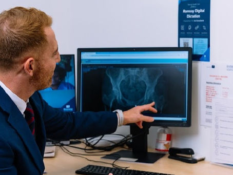 Mr David George reviewing a hip X-ray