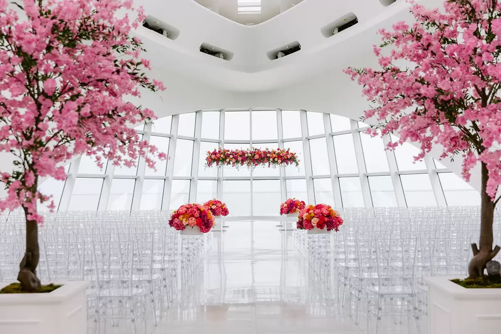 The Milwaukee Art Museum decorated with trees and flowers for a wedding ceremony