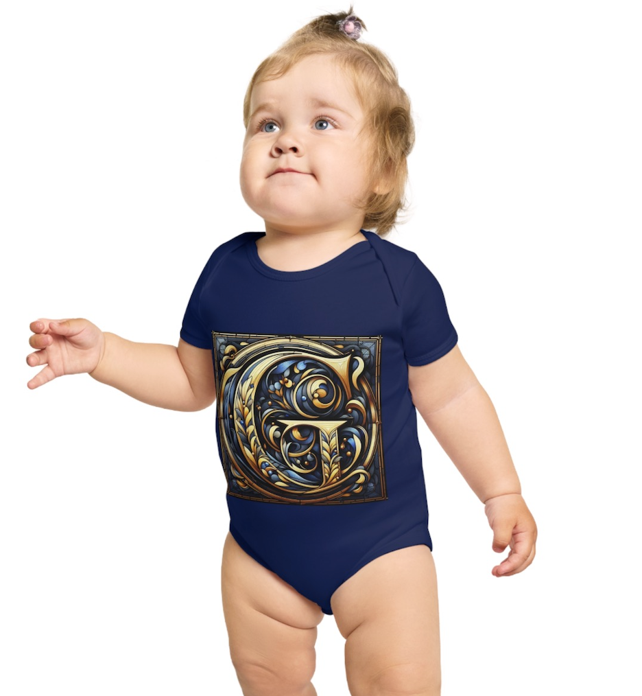 Baby wearing a navy blue onesie with a blue and gold and G logo on the front designed to connect the youngest Ginsberg Family generations