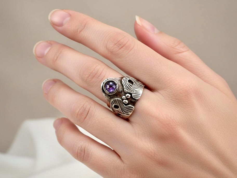 Crown Ring on model hand featuring sterling silver band and lavender Cubic Zirconia crown stone