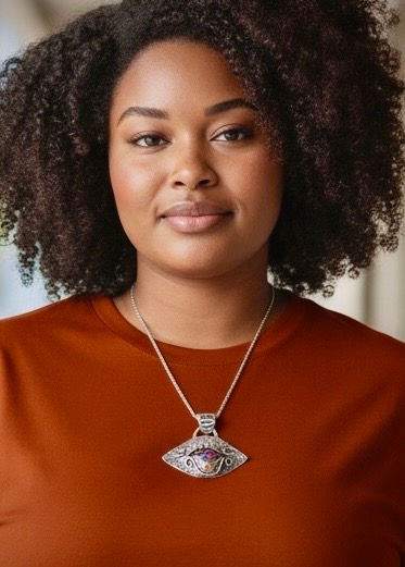 Eye See You #3 dichroic glass pendant worn by model, showing size, placement, and vibrant orange shimmer on chest.