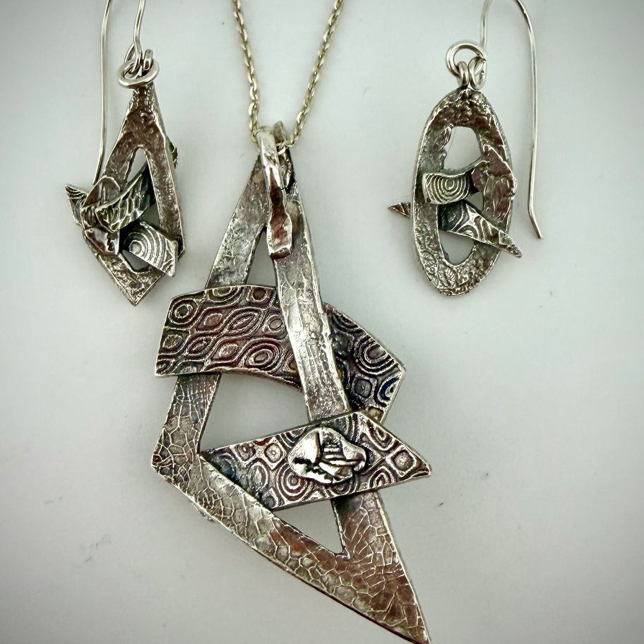 Back view of Geometric Set 1 necklace and earrings showing sterling silver settings and craftsmanship details