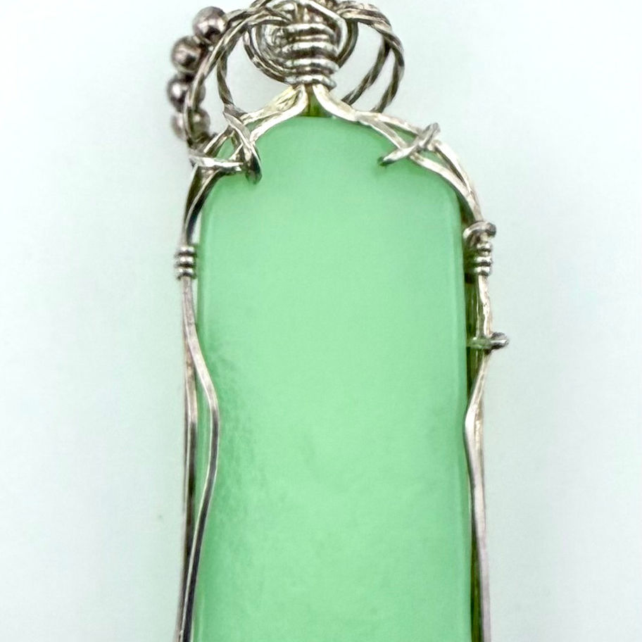 Back view of Lime Daiquiri pendant showing single-color dichroic glass and sterling silver wire finishing.