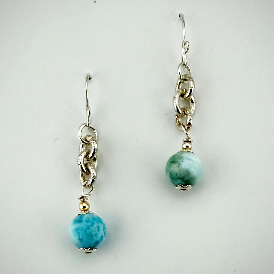 Front view of Larimar bead earrings with fine silver chain, showing ocean-blue gemstones and graceful sway.