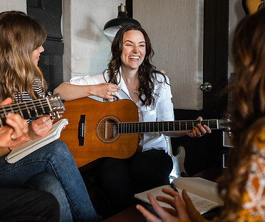 life coach and songwriter rebekah powell plays music and guitar for women at the rhythm of joy retreat in nashville tennessee