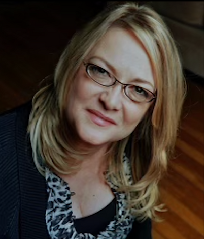 June Grushka-Rosen, founder of Extraordinary Women's League and master life coach smiles on the rhythm of joy retreat in nashville tn