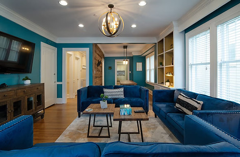 teal living room with blue couches in the music city mansion at the rhythm of joy womens empowerment life coaching retreat in nashville tn with june grushka-rosen from extraordinary women's league and rebekah powell, songwriter and master coach