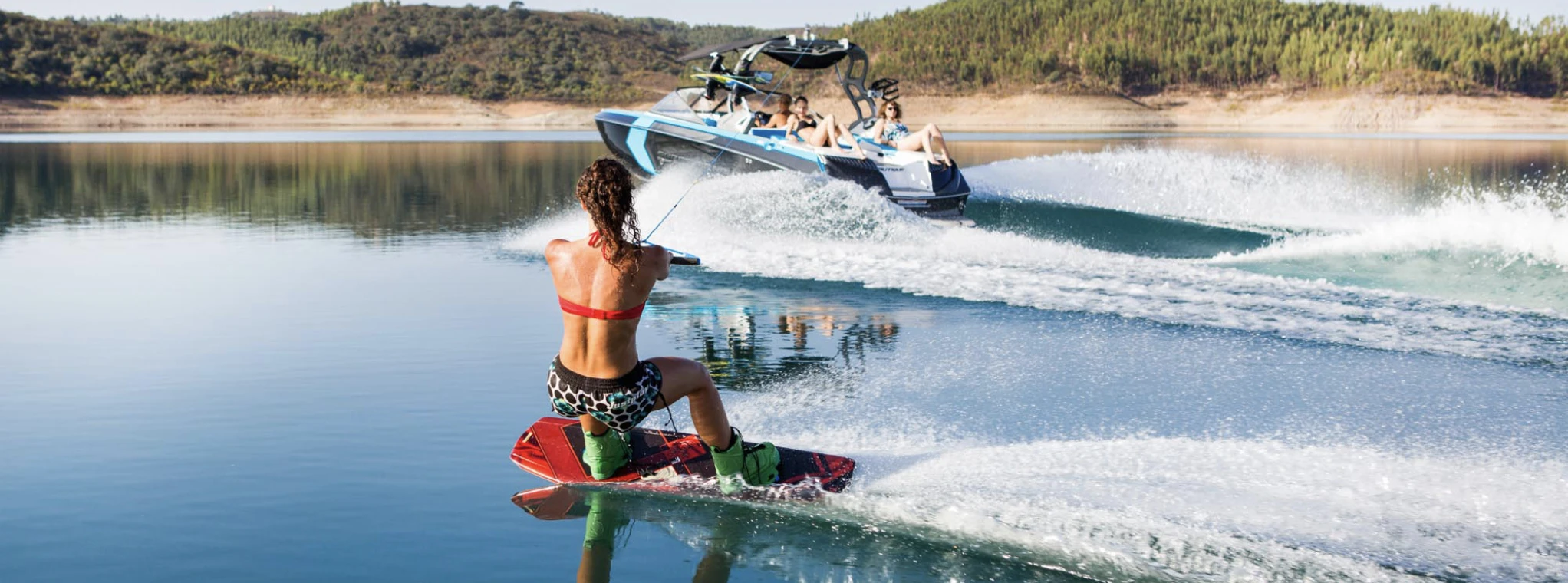 Wakeboarding and bowriding by a woman at Castelo de Bode Lake in Ferreira do Zêzere, Portugal