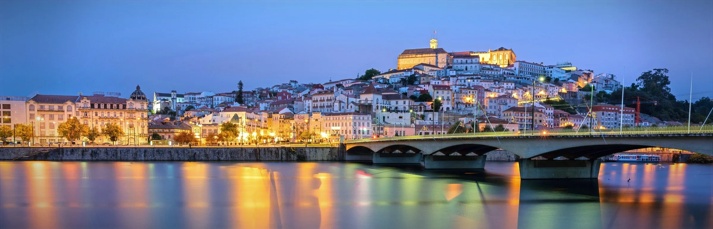 Coimbra riverfront at dusk, Portugal.