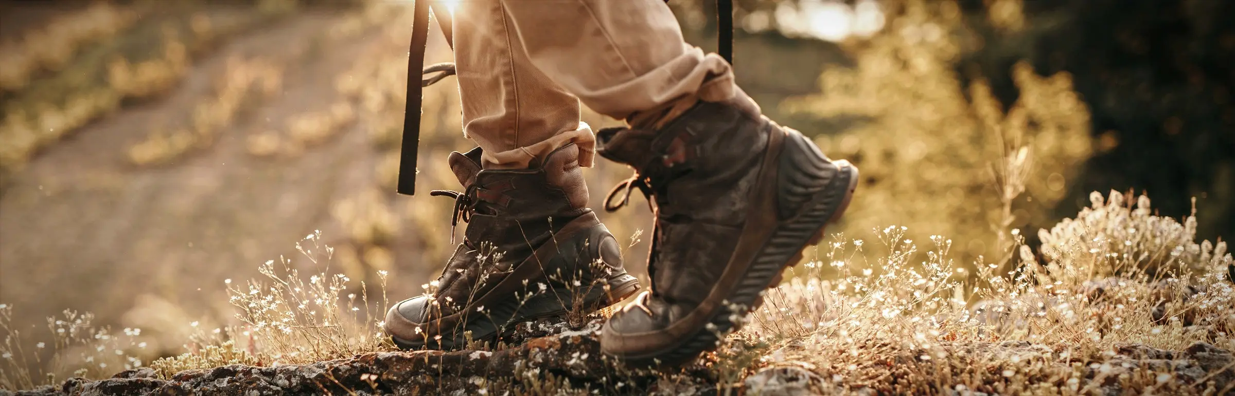 Hiking boots close-up at dawn, Castelo de Bode Lake, Ferreira do Zêzere, Portugal.