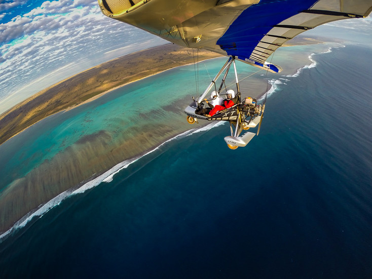 Microlight flying over Ningaloo Reef