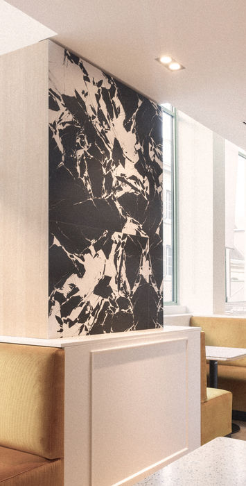 Dans ce projet d’architecture intérieure, nous avons créé un coffee shop de 100 m² pour la marque SEASON, alliant design moderne et matériaux raffinés. Chaque détail a été pensé pour offrir une expérience client unique et immersive. L'espace présente des éléments sur mesure, avec des bancs en tissu côtelé, des murs en marbre emblématique signé Mathias Kiss, et des tables en terrazzo. Cet espace retail a été conçu pour offrir une atmosphère chaleureuse et accueillante, favorisant la détente et l’échange. Nous avons intégré des solutions sur mesure pour créer un lieu fonctionnel et esthétique, où le design et la fonctionnalité se rencontrent pour répondre aux besoins d’un coffee shop moderne