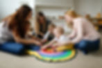 Group of mothers with babies in a lesson at a kindergarten center, Montessori kindergarten