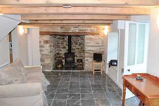 Inglenook fireplace in stone cottage Cubert