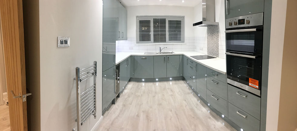 New kitchen installation with laminate flooring apartment renovation Newquay Cornwall