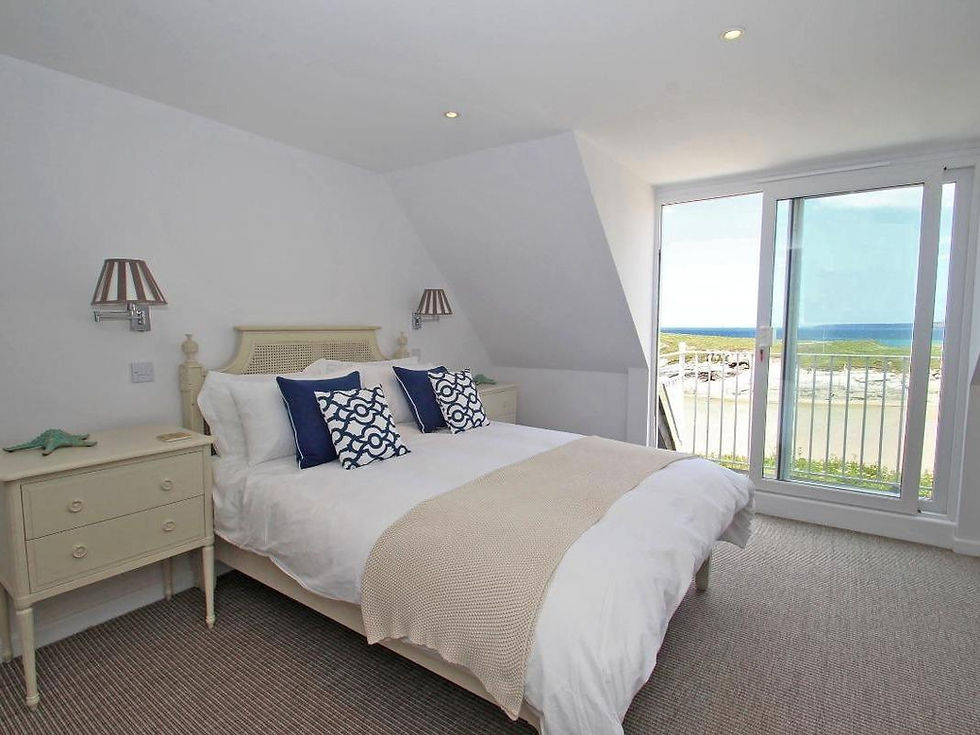 Bedroom with sea views furnished holiday let Porth Beach