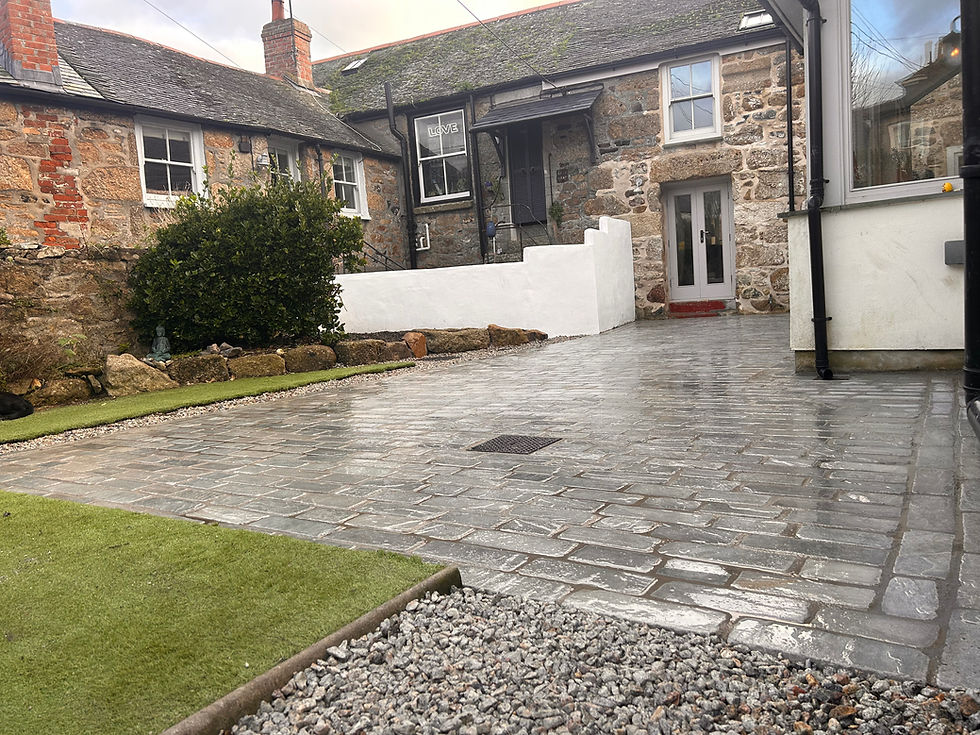 Completed limestone sett patio garden Mousehole Penzance