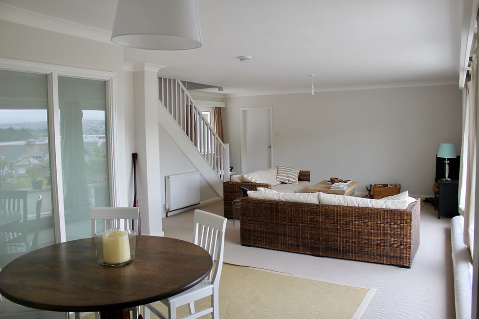 Dining area with round oak table house renovation Flushing Falmouth