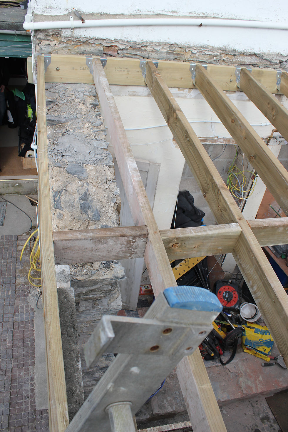 Installing timber joists for shop refit works Newquay Cornwall