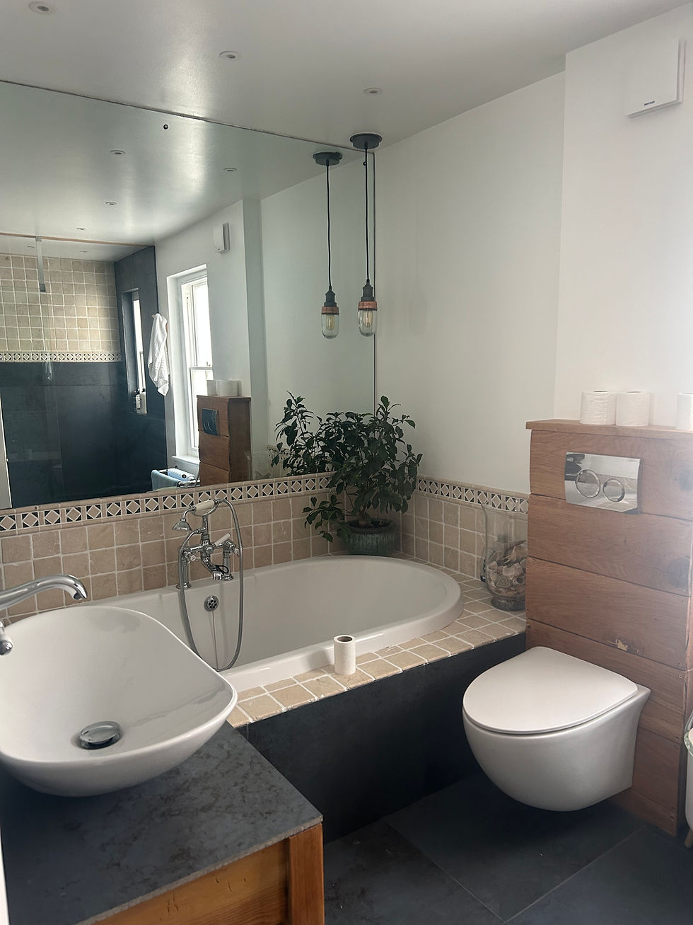 Completed bathroom with original bath tub, custom WC unit and vanity Newquay