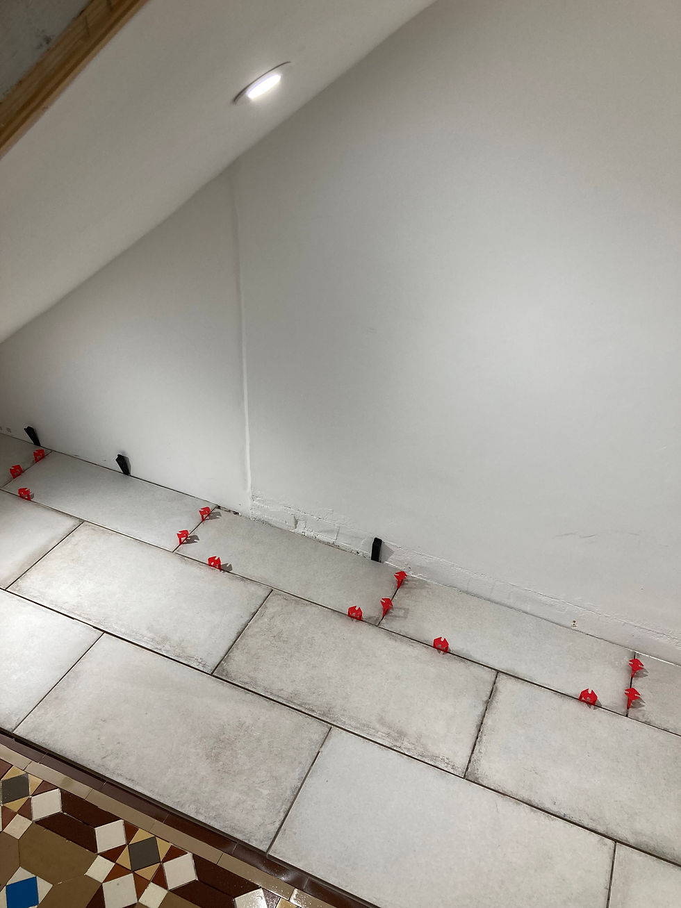 During works tiling under stairs with spacers Newquay