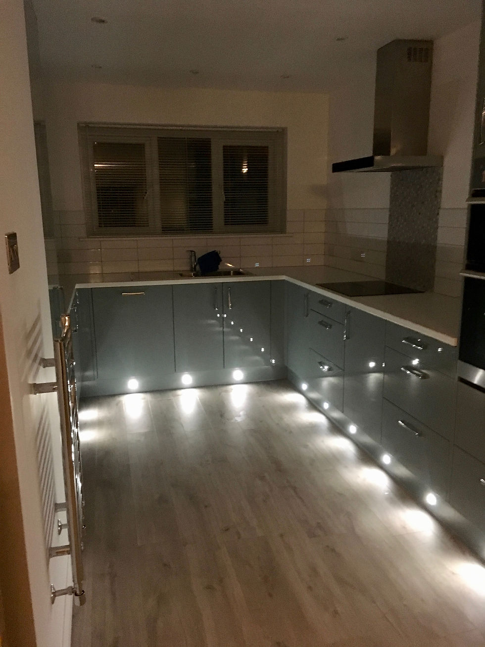 New kitchen with LED floor lighting laminate flooring apartment Newquay