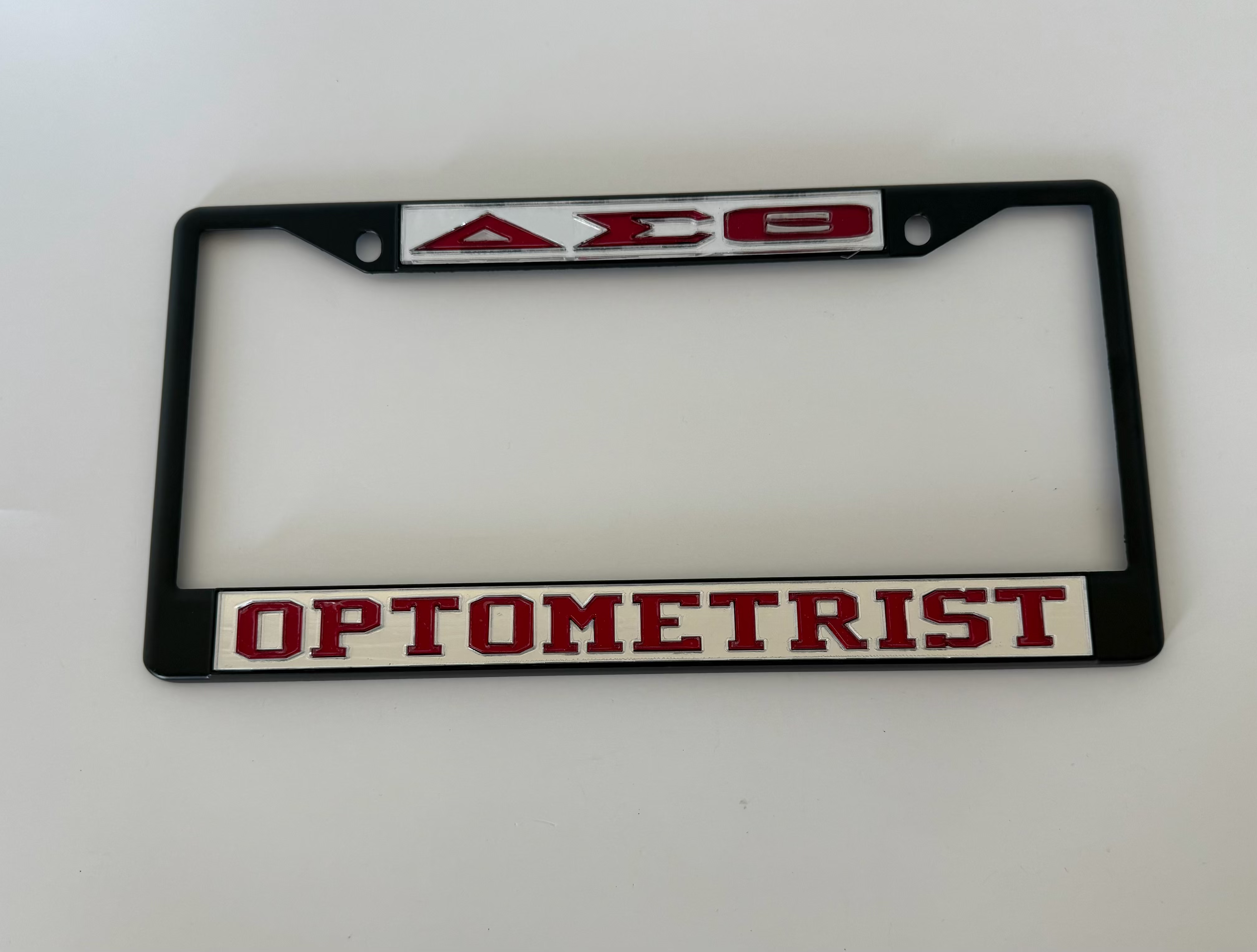 DST Optomerist Blk Frame- Mirror Background Red Letters
