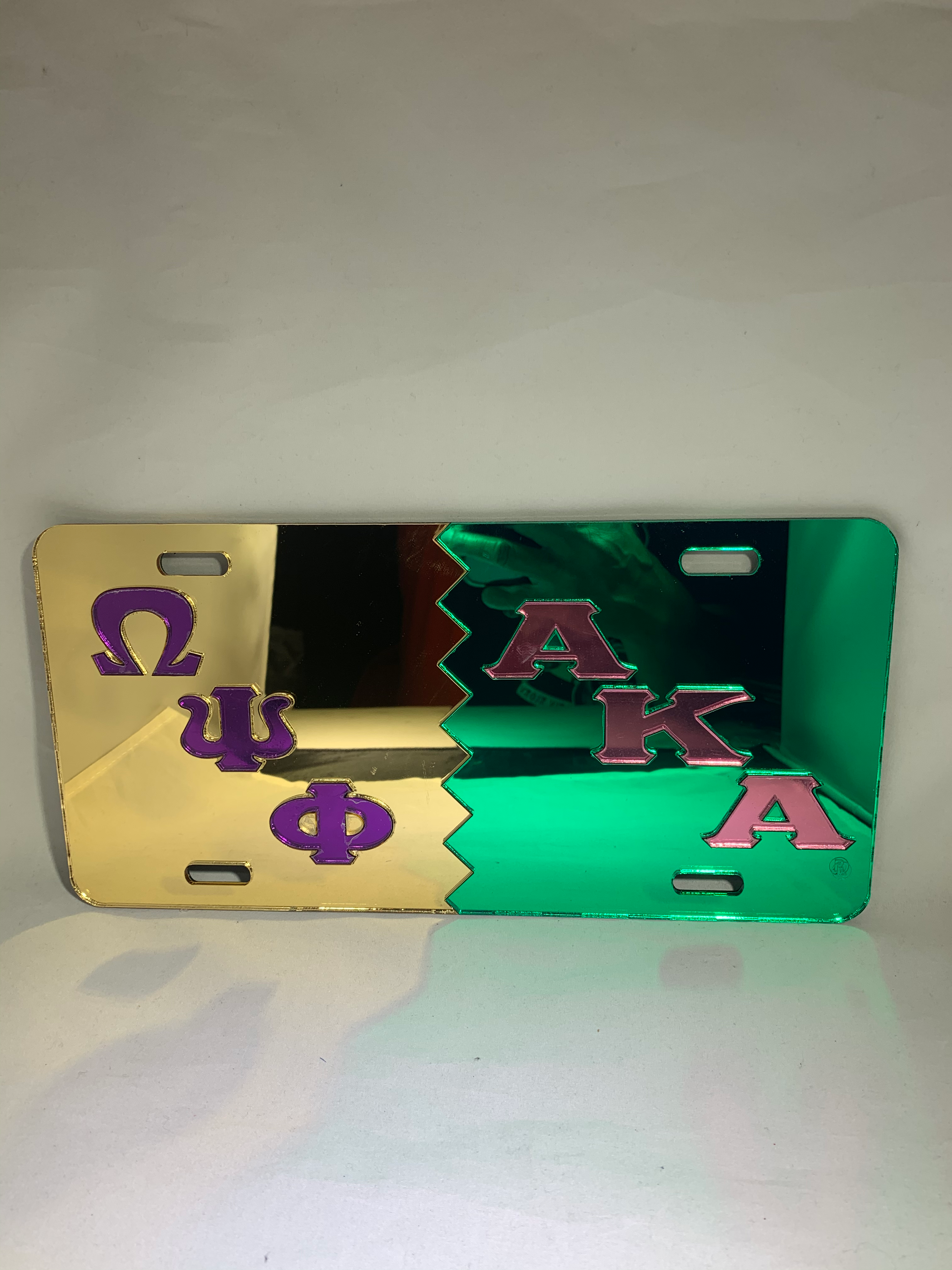 OPP/AKA Splt License Frame- Gld Bckgrnd Purple Letters Pink Bckgrnd Green Ltrs