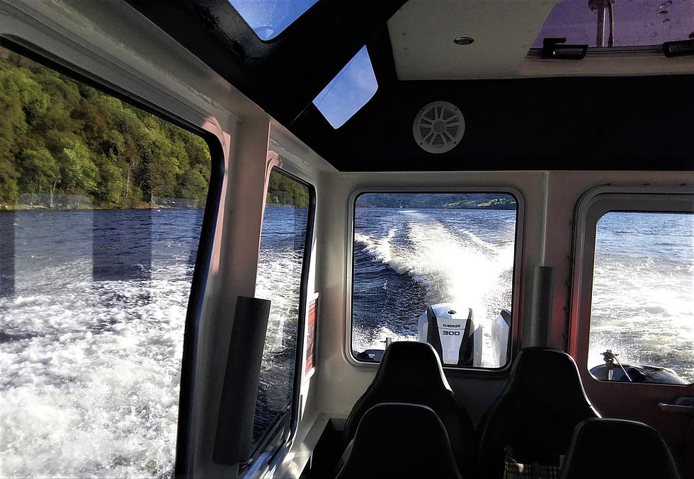 Inside the boat, looking out over the loch.