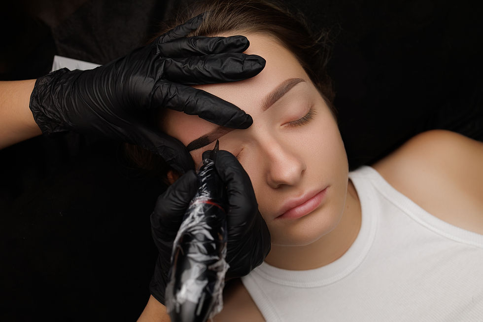 Close-up of the hands of the master who performs the procedure of permanent makeup of eyeb