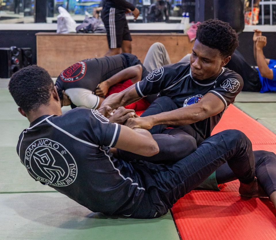 Two men doing brasilian Jiu Jitsu at a gym in Stone Town, Zanzibar. BJJ community