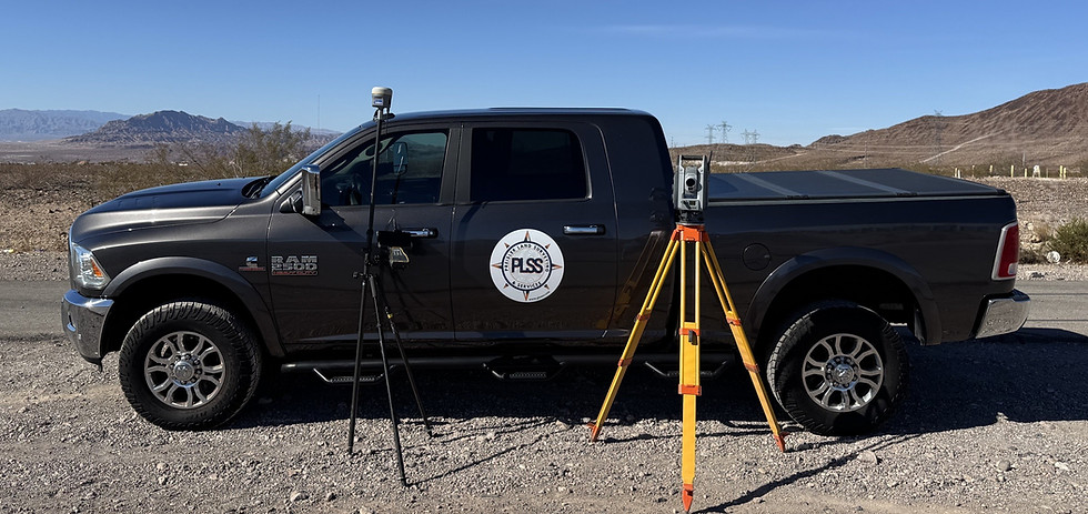Professional land surveying truck and tripod in the desert