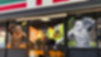 Window decals on a convenience store entrance showing Sasquatch and Yeti flanking a pack of Jack Link’s Duos, with a headline that says, “Nothing like a great duo.”