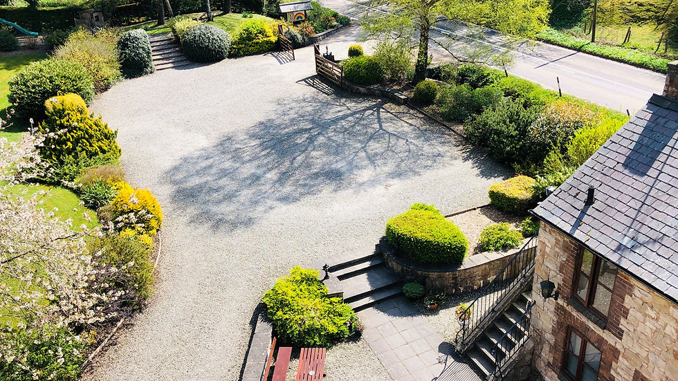 Holiday Accommodation near Moel Famau, Clwydian Range, Flintshire. Large car park, gardens and historic building with steps