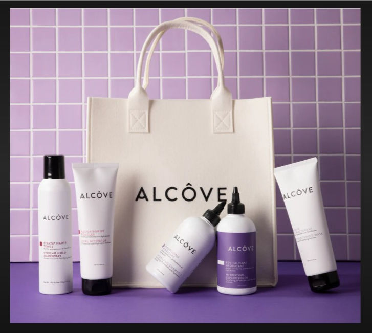 Eye-level view of bathroom shelf with clean hair care products from Alcove