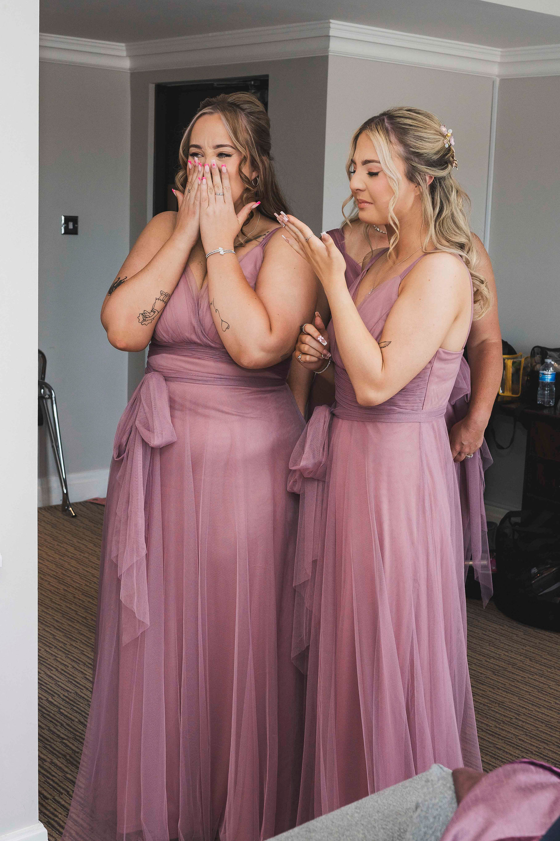 Sharon’s bridesmaids together in pink dresses at the Guidepost Hotel.