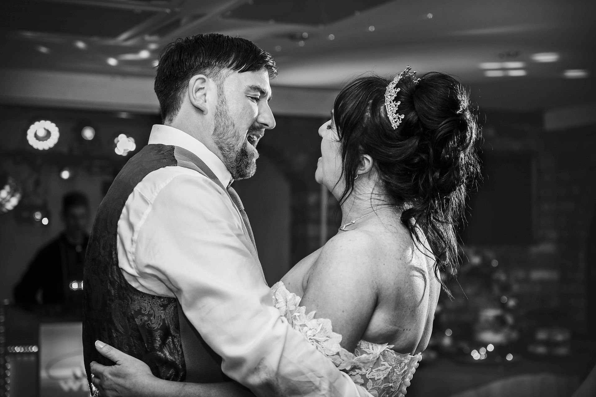 Sharon and Gary smiling on the dance floor at their Bradford wedding.