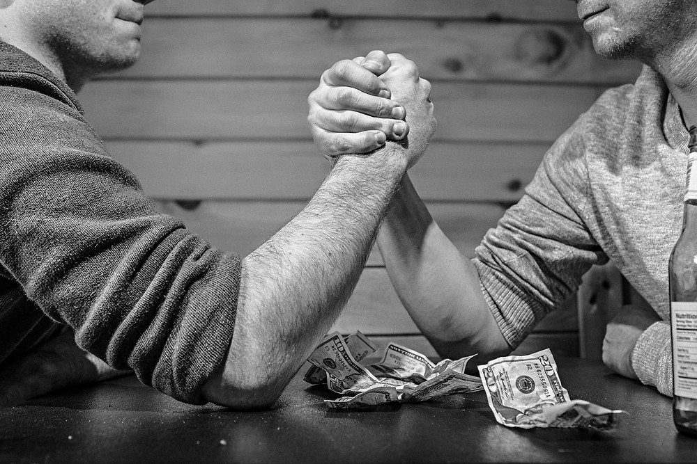 Arm wrestle, negotiate salary