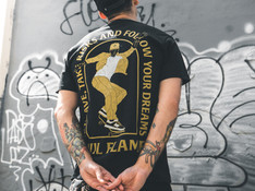 Man Looking at Graffiti